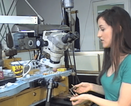 Jeweler making a custom diamond engagement ring Jeweler working on custom engagement ring setting