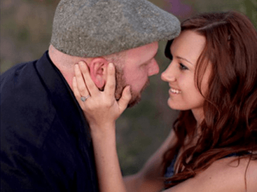 Couple Smiling At Each Other With Diamond Wedding Ring