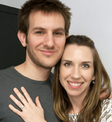 Make It Extra Special. Contact Us For A Custom Design Engagement Ring! Custom design engagement ring that a couple are smiling about.