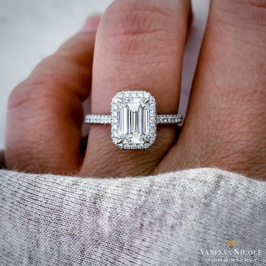 SUE C emerald cut diamond with platinum halo micropave setting