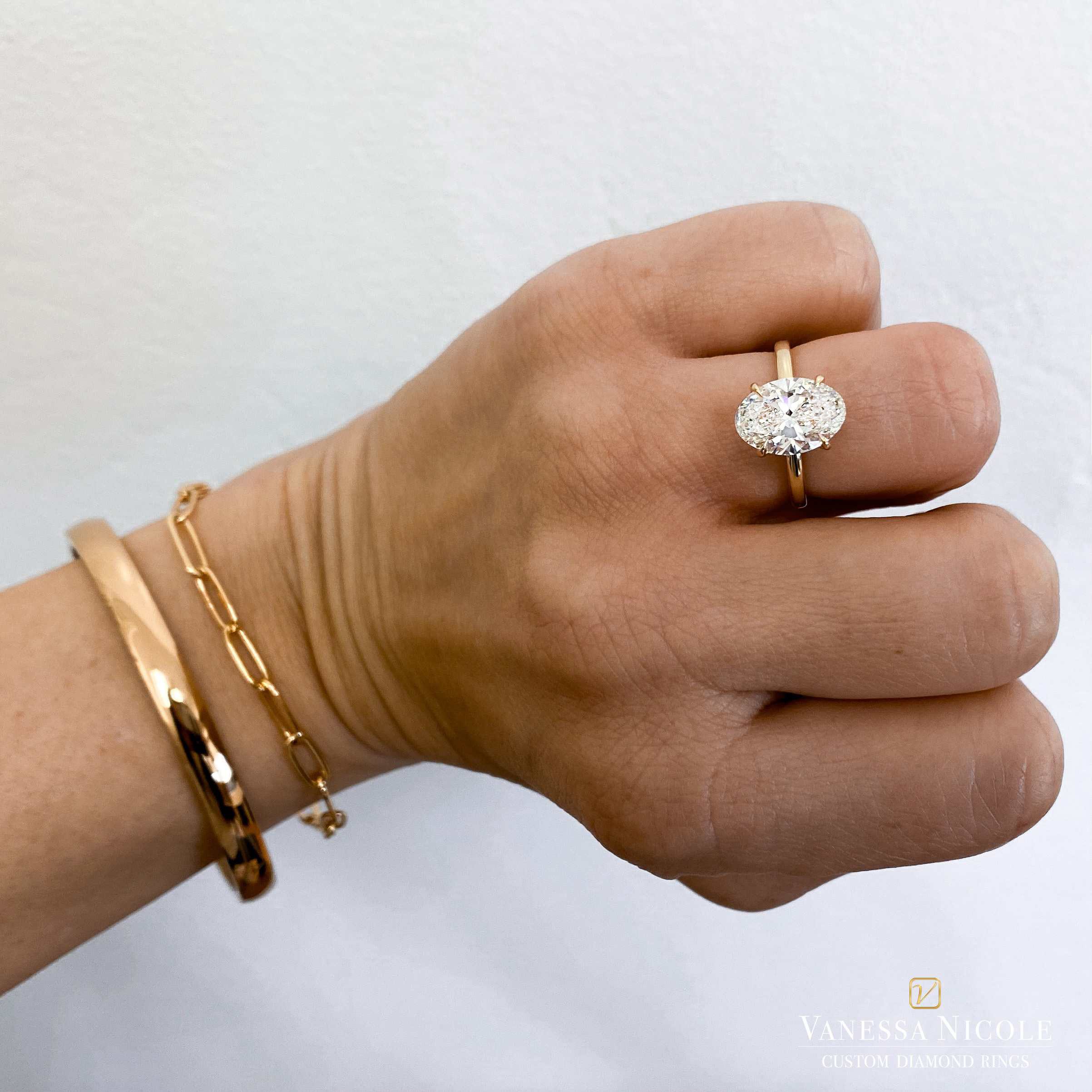 3ct Oval Solitaire 3ct Oval Diamond solitaire engagement ring in 18k gold setting